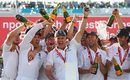 The England team celebrate with champagne