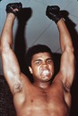 American boxer Cassius Clay (who changed his name to Muhammad Ali in 1964) growls firecely.