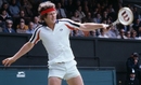 John McEnroe hits a backhand at the 1979 Wimbledon Championships.