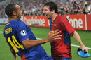 Thierry Henry celebrates with goalscorer Lionel Messi