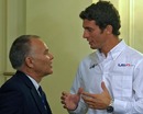 Jose Maria Lopez (right) talks with US F1 sporting director Peter Windsor