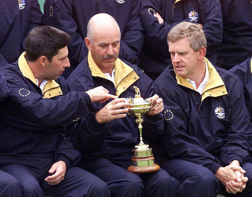 Jose Maria Olazabal and Colin Montgomerie sit either side of Mark James