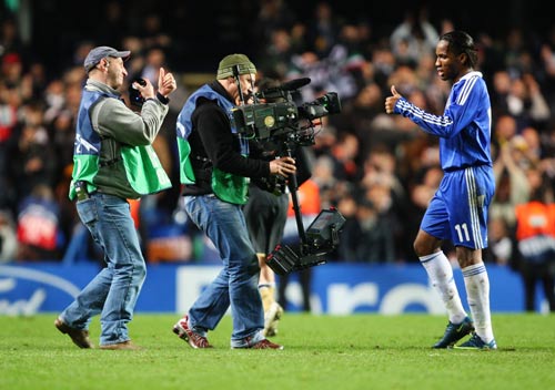 Didier Drogba gives a thumbs up to the camera