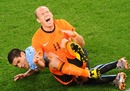 Arjen Robben is felled by Maximiliano Pereira