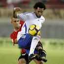 Jermaine Pennant holds off a tackler