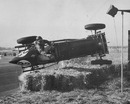 A British ERA racing car, driven by G Ansell in mid-air during a crash 