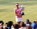 Paula Creamer shows off her trophy to photographers
