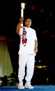 Muhammad Ali holds the torch before lighting the Olympic Flame