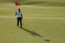 Alejandro Canizares moves to replace the flag on the 12th hole
