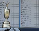 The Claret Jug stands in front of the leaderboard