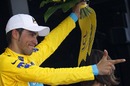Alberto Contador celebrates taking control of the yellow jersey