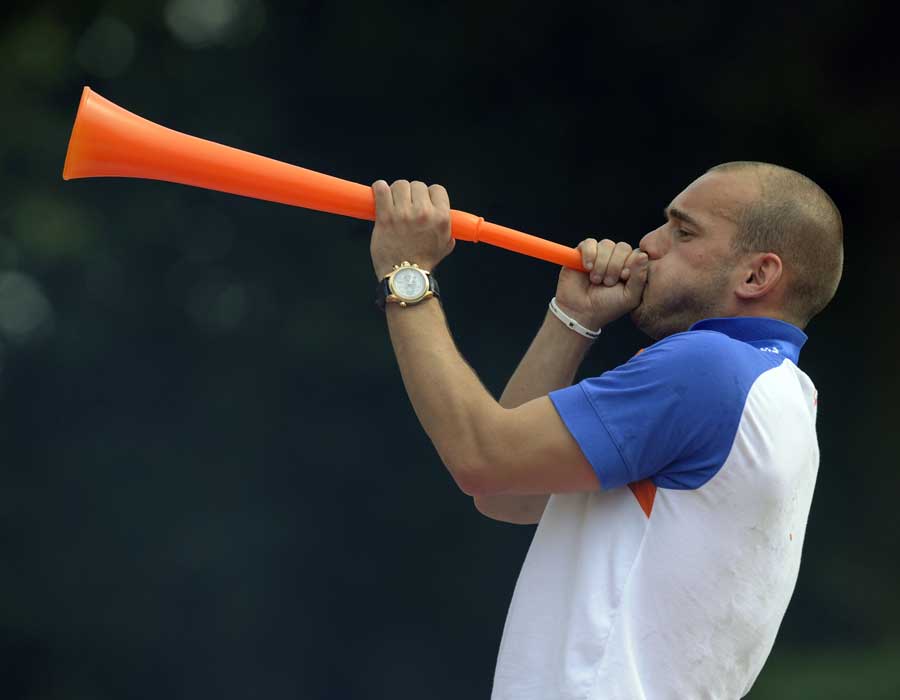 Wesley Sneijder blows a vuvuzela