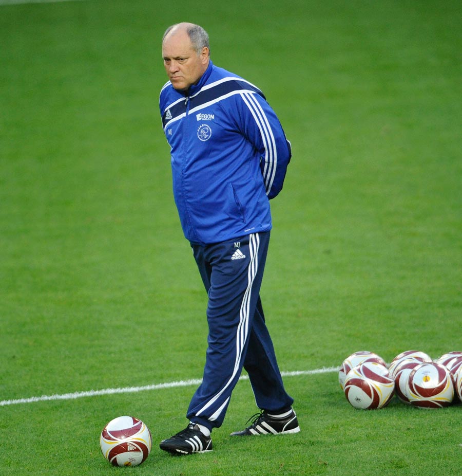 Martin Jol controls a ball during a training session