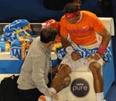 Rafael Nadal has treatment on his knee