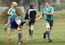 Richie McCaw offloads during training