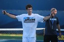 Andy Murray stretches off