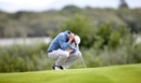Rory McIlroy puts his head in his hands