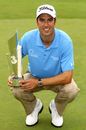 Ross Fisher clutches the Irish Open trophy
