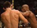 Anderson Silva throws a left in the direction of Demian Maia