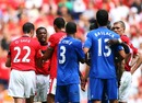 Patrice Evra is restrained as he argues with Michael Ballack