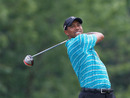 Tiger Woods plays a shot during a practice round