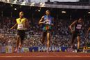 Tyson Gay crosses the line ahead of Usain Bolt
