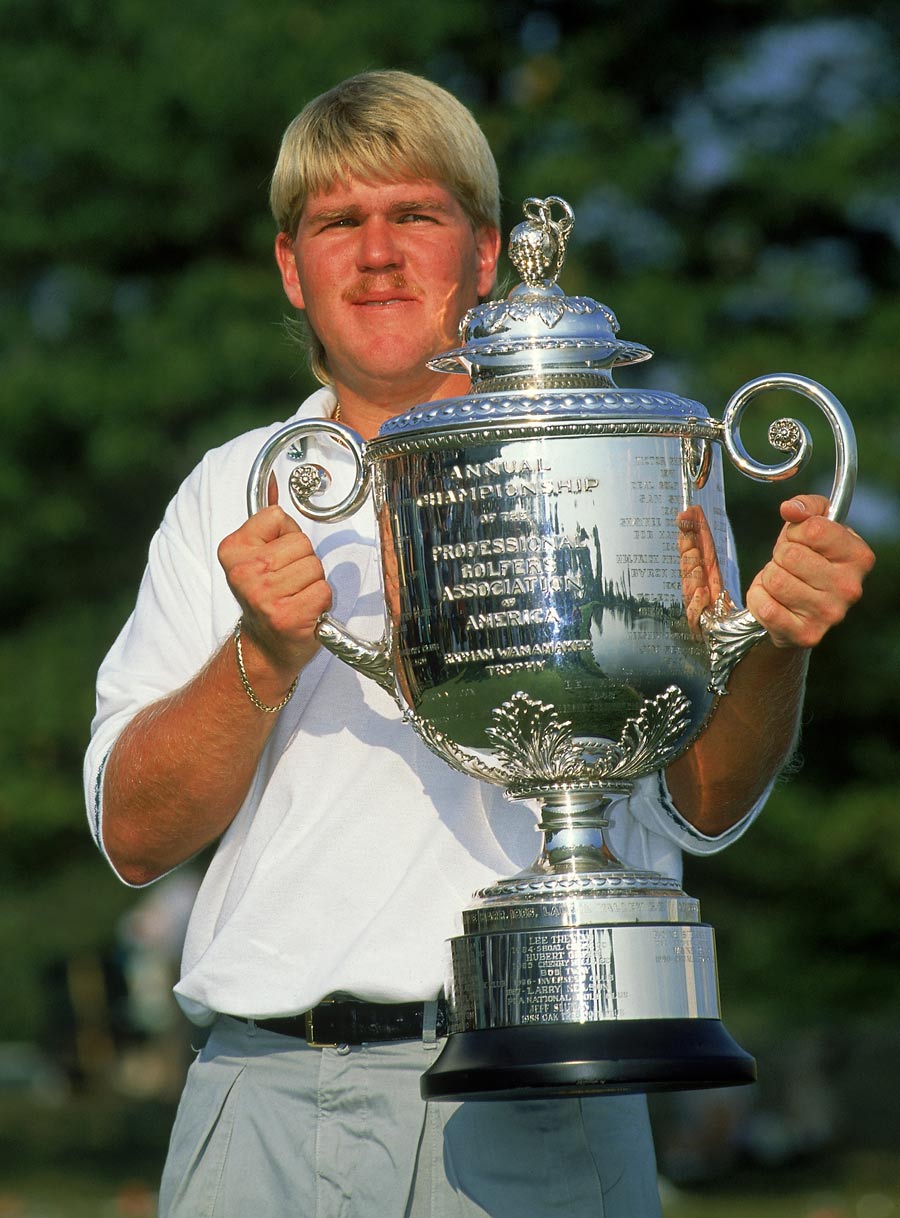 John Daly holds his trophy
