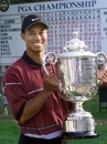 Tiger Woods shows off the US PGA trophy