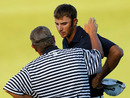A rules official informs Dustin Johnson he is likely to pick up a penalty