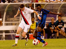 Adam Johnson tangles with Inter Milan's Victor Obinna