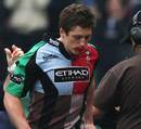 Harlequins wing Tom Williams walks from the field