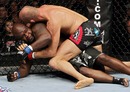 Randy Couture looks for an arm triangle against James Toney