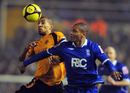 Marcus Bent tussles with Karl Henry
