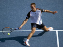 Viktor Troicki stretches to play a volley