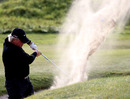 Simon Edwards splashes out of a bunker