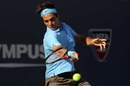 Roger Federer strikes a forehand