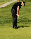 Phil Mickelson wills his putt in at the Farmers Insurance Open