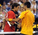 Novak Djokovic congratulates Roger Federer