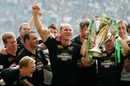 Lawrence Dallaglio celebrates with his team-mates after winning the Heineken Cup