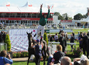 Frankie Dettori performs a flying dismount after victory on Eastern Aria
