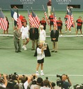 Andre Agassi kisses the winner's trophy after defeating Todd Martin