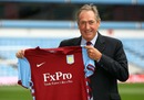 Gerard Houllier poses with an Aston Villa shirt