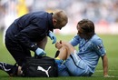 Luka Modric receives medical attention before being substituted 
