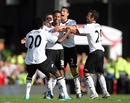 Moussa Dembele is mobbed after scoring Fulham's winning goal