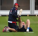 Andrew Flintoff receives treatment to his injured knee