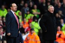 Rafael Benitez and Sir Alex Ferguson watch from the touchline