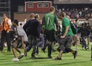Fans storm the pitch