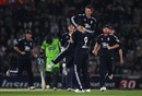 Graeme Swann is mobbed by his team-mates