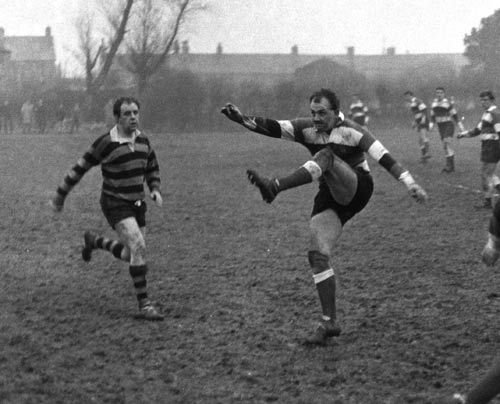 Clive Rowlands sends a kick towards touch