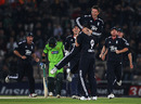 England celebrate Graeme Swann's latest first-over strike